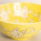 Large Yellow Ceramic Bowl with White Floral Designs