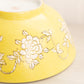 Large Yellow Ceramic Bowl with White Floral Designs