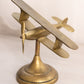 Medium Brass Tilted Airplane Figurine on Circular Base