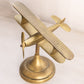 Medium Brass Tilted Airplane Figurine on Circular Base