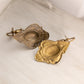 Small Brass Wall Sconces with Oval and Floral Designs (Set of 2)