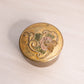 Small Gold Circular Brass Enameled Lidded Dish with Floral Design on Top