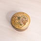 Small Gold Circular Brass Enameled Lidded Dish with Floral Design on Top