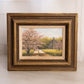 Small Horizontal Log Cabin & Pink Tree Painting with Brown Frame