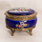 Small Oval Blue Ceramic Hinged Lidded Music Box with Floral Designs