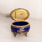 Small Oval Blue Ceramic Hinged Lidded Music Box with Floral Designs