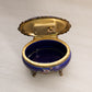 Small Oval Blue Ceramic Hinged Lidded Music Box with Floral Designs