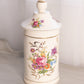 Tall Cream Ceramic Lidded Jar with Floral Designs and Gold Details