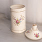 Tall Cream Ceramic Lidded Jar with Floral Designs and Gold Details