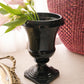 Vintage Black Glass Footed Urn Vase with Embossed Details