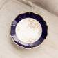 Vintage Blue Ceramic Bowl with Floral Designs and Wall Hanger