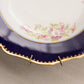 Vintage Blue Ceramic Bowl with Floral Designs and Wall Hanger