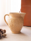 Medium Tan Ceramic Pitcher with Floral Details