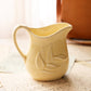 Vintage Small Yellow Pottery Pitcher with Leaf Details